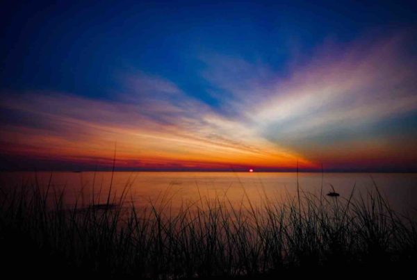 beautiful michigan sunrise photo over lake