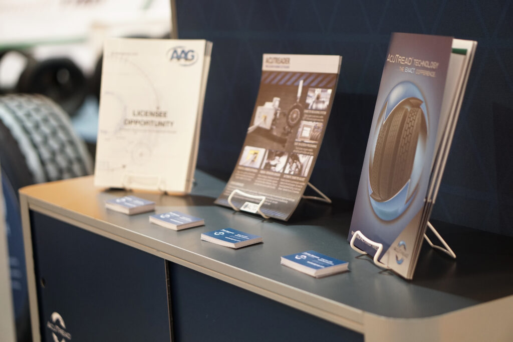 Printed materials in the AcuTread booth at a trade show