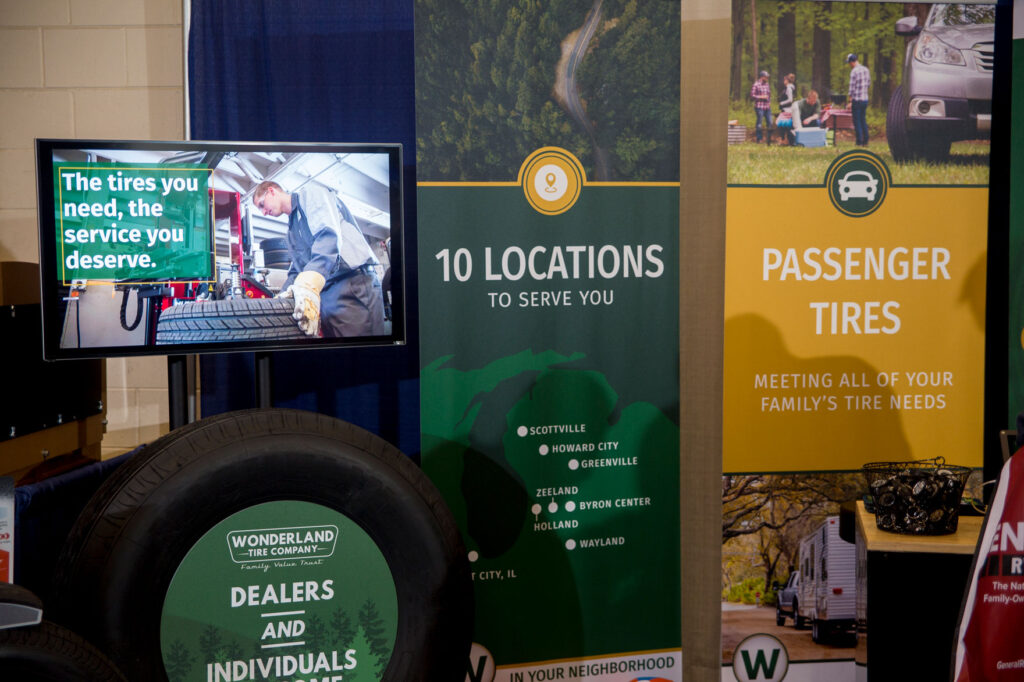 Banners in the Wonderland Tire booth at a trade show